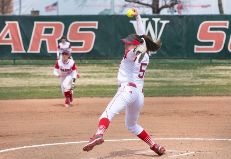 Freshman Madison Denton pitches against Illinois Wesleyan University. Denton shut out Illinois Wesleyan in the second game of the Schutt Invitational despite loaded bases in the last inning.