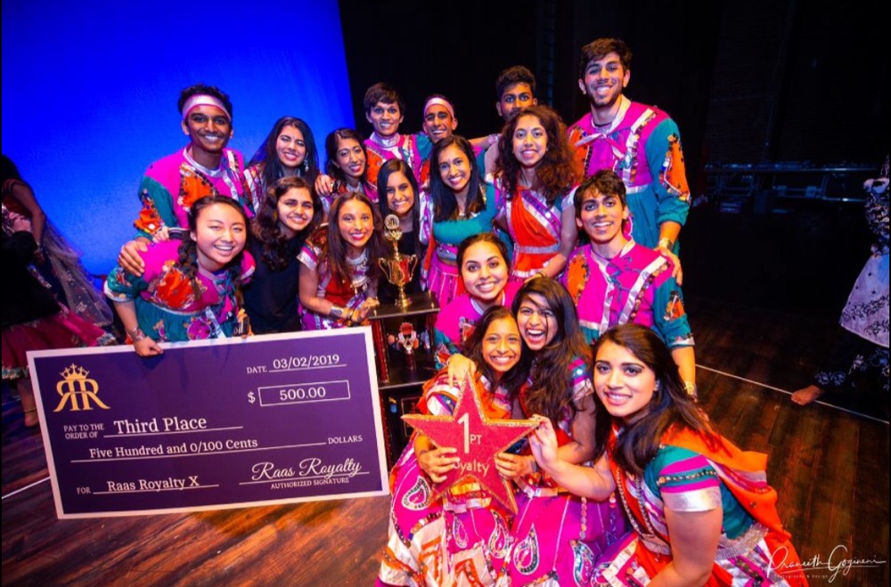 Dance team WashU Raas poses with their prize after placing third at the Raas Royalty dance competition at Indiana University. WashU Raas placed for the first time in four years of competition. The team also performs on campus as events such as Diwali.