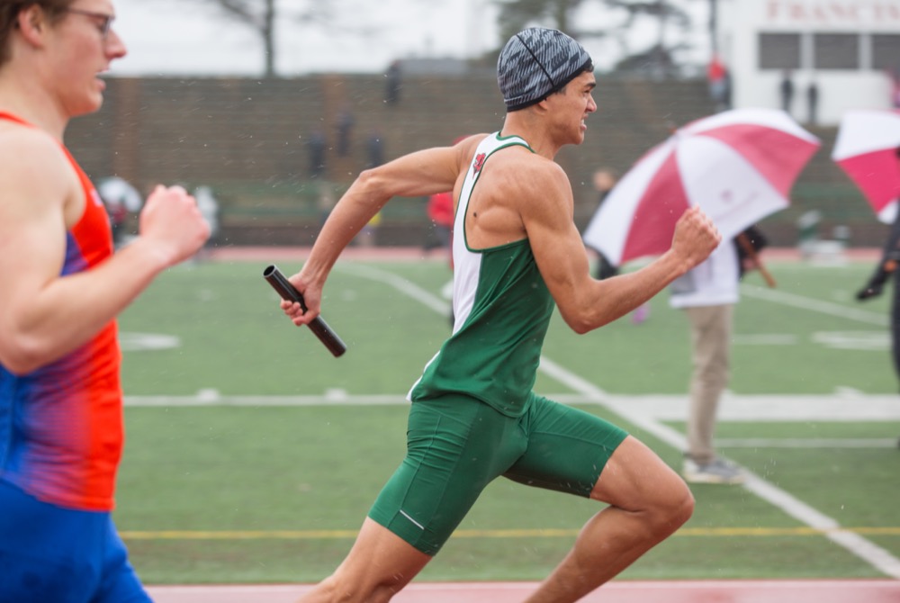 John Harry Wagner runs the 4x100 meter relay at the WashU Invite March 30. The Washington University track and field teams will travel to Atlanta to compete in the UAA championships.