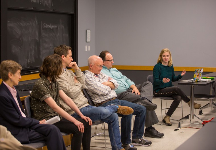 Emma Waltman moderates the climate conversation on the Green New Deal Wednesday. The discussion, hosted by the Wash- ington University Climate Change Program, featured a panel of University faculty, staff and students from different disciplines.