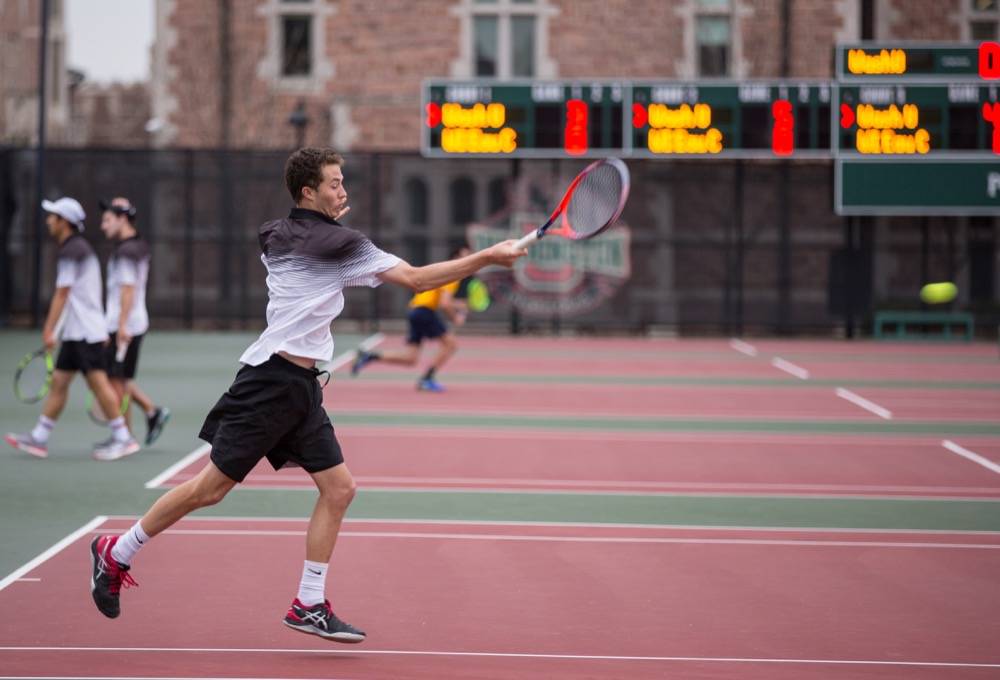 Sophomore Ethan Hillis hits an approach shot against UW-Eau Claire on Apr. 5. The men’s team lost to University of Chicago this weekend after beating Case Western Reserve University.
