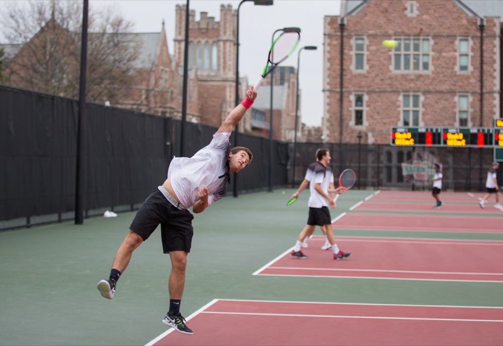 Junior Bernardo Neves serves against University of Wisconsin-Eau Claire opponents Friday. The No. 8-ranked Bears men’s tennis team improved their record to 11-4 with a 9-0 sweep.