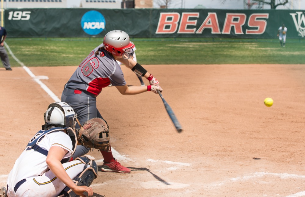 Taylor Arends swings at an Emory University pitch on Apr. 6.