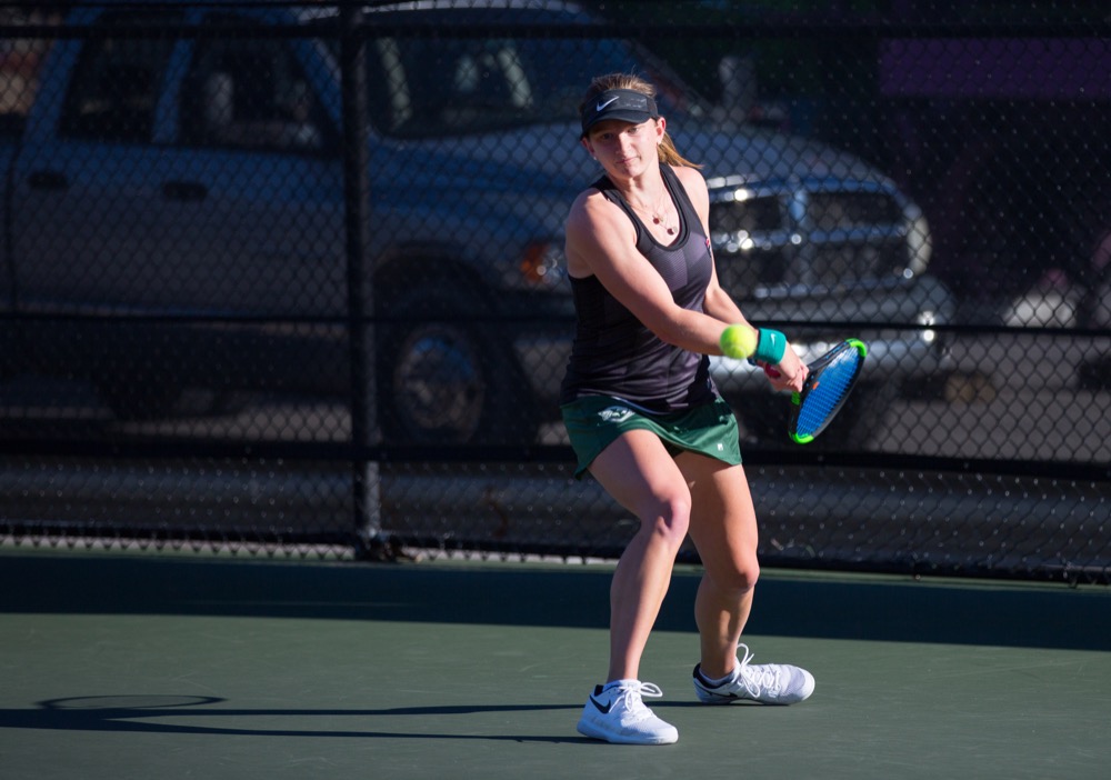 Ally Persky hits a backhand against Principia College on Apr. 9. The No. 15 women’s tennis team beat Case Western Reserve University and lost to University of Chicago this weekend.