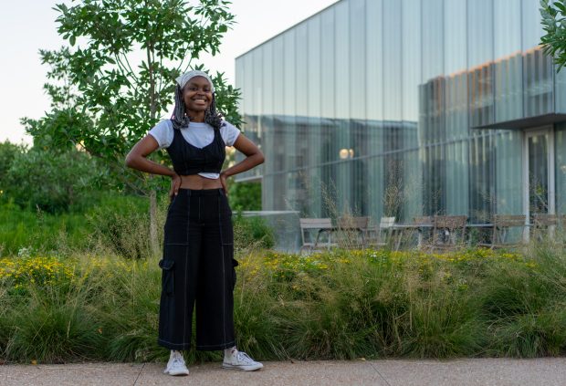 Jamila Dawkins stands on the East End, hands on her hips, wearing black cargo pants.